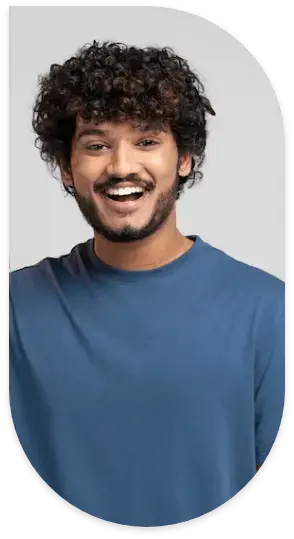 A person wearing a blue shirt is smiling after hair treatment.